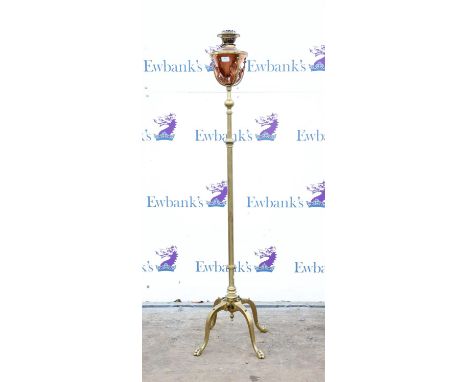Late Victorian brass and copper standard oil lamp, with extending stem, the copper reservoir with flame motifs, on four cabri