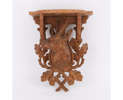 Late 19th/early 20th century Black Forest carved oak wall bracket with a deer and oak leaves, 26 cms wide x 39 cms high