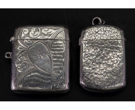A Victorian silver vesta case, George Unite, Birmingham 1892, rounded rectangular engraved with leaves around a vacant cartou