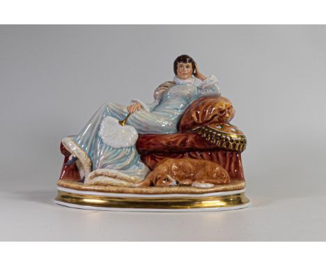 Arena Staffordshire china figurine of a lady seated on a couch. Marked specialy painted for K Taylor to base 