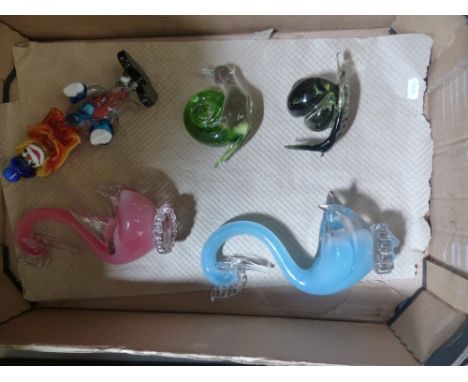 A collection of glassware to include a Wedgwood snail paperweight, similar snail paperweight, art glass swans and a vintage g