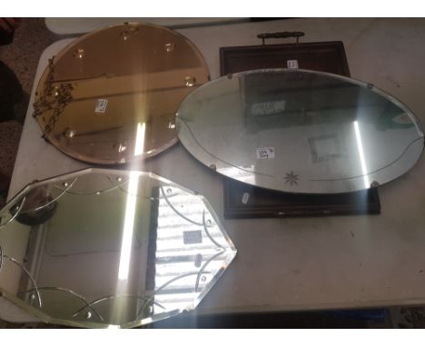 Three vintage frameless mirrors, one with coppertone glass together with a twin handled oak tray (4). 