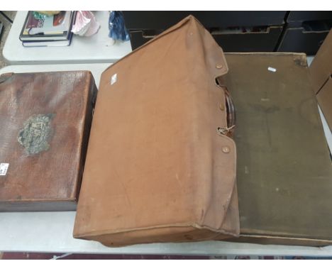 Three pieces of vintage luggage to include small leather case with keys and 2 canvas military/demob type cases (3). 