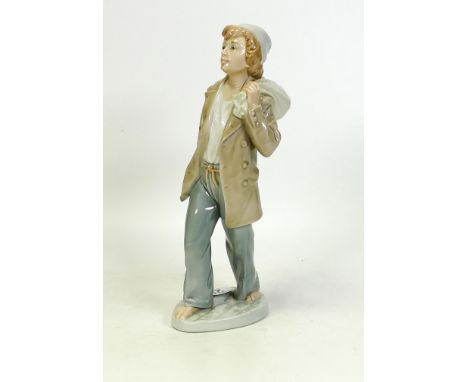 Nao figure of a boy carrying a sack on his shoulder. Height 23cm 