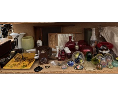 A collection of glass paperweights together with cranberry glass, a Bell &amp; Howell model 605 camera, magnifiers, washboard