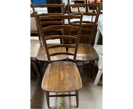 Ensign - A set of three mid 20th century ladder back dining chairs, on tapering legs