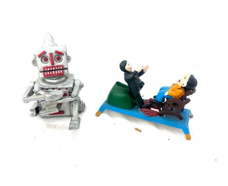 Two vintage cast iron money boxes one robot 