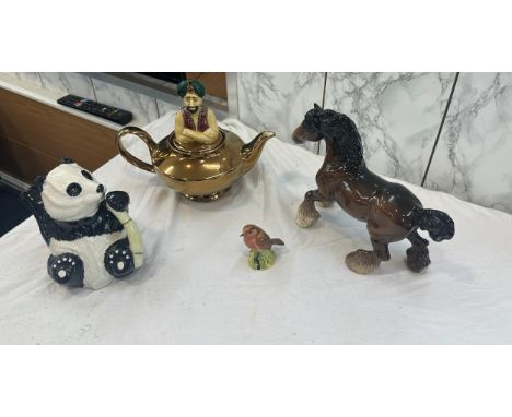 Selection of beswick items to include tea pot, horse, bird and a wade tea pot 