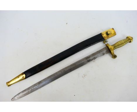 A sword in the style of a French artillery gladius sidearm with a ribbed brass hilt, cross guard with circular quillons and 4