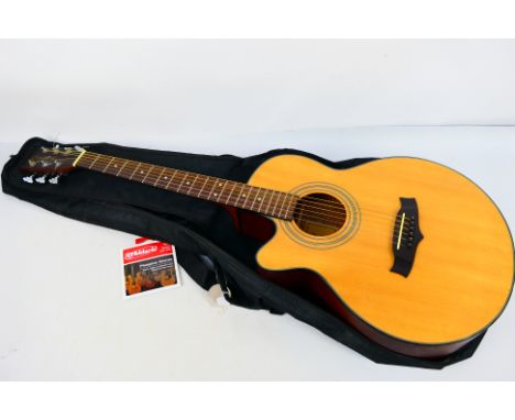 A Tanglewood left handed electro acoustic guitar, model TFC-E-LH NA, contained in soft case with spare strings. [W]
PLEASE NO