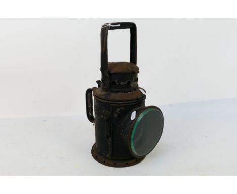 A black painted lantern / lamp marked Mutlow 1940 London, 34 cm (h). [W]
PLEASE NOTE: ALL ITEMS MUST BE PAID FOR  AND COLLECT
