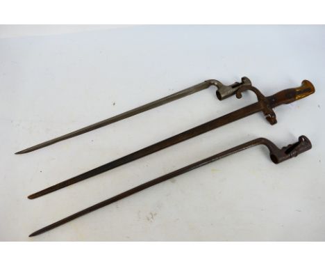 Three bayonets comprising an 1874 pattern Gras bayonet, 63 cm (l) and two socket bayonets. [W]
Note: This lot is not for sale