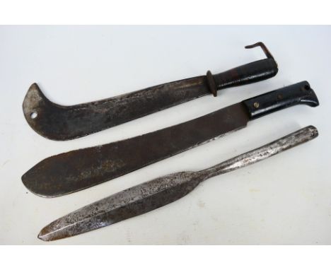 Lot to include a billhook, machete and spearhead (45 cm length). [W]
Note: This lot is not for sale to people under the age o