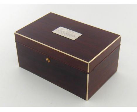 A mahogany  Dunhill cigar  humidor, the lid with applied presentation plate. 23x21x16cm.  CONDITION REPORT: Light scratches a