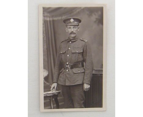 The British Army of World War I (PART 2):-  A large group of WWI era R/P postcards featuring regimental groups, camps, studio