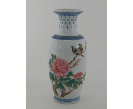  A Chinese ceramic vase with enamel birds, flowers and foliage, character script and red seals on body, four character mark t