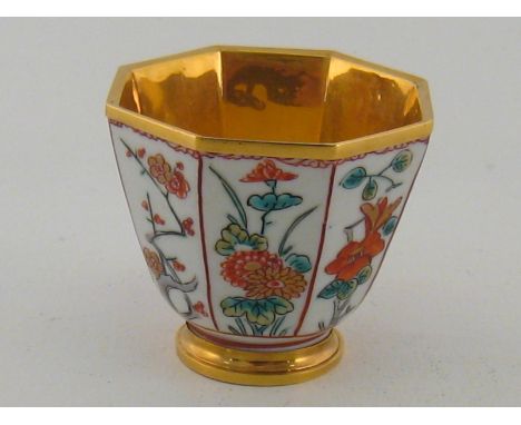 A Chinese ceramic  octagonal libation bowl with yellow metal, (tests high carat gold), lining. 