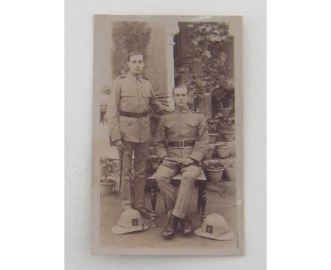 Regimental topi flashes and tropical helmets:- An interesting group of 2 cabinet photos, a named group photo, 3 small photos,