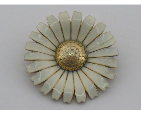 A 1970s Danish silver gilt and enamel daisy brooch by Anton Michelsen, 50 mm diameter, 25.7 gms. The brooch was originally de