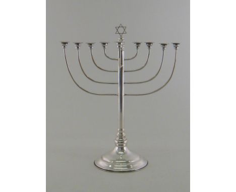 Judaica:- a silver Menorah, the plain slender column on circular pedestal foot, maker's mark M.S attributed tentatively to Mo