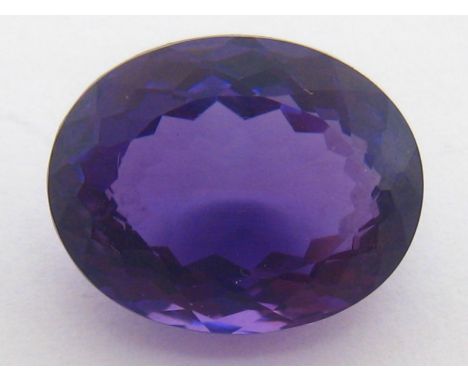A loose oval cut amethyst, 2.9 gms (14.9 carats), 17.4 x 13.75 mm length. VAT will be added to the hammer on this lot. CONDIT