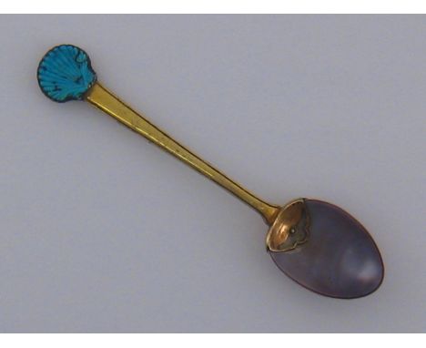 An unusual silver-gilt spoon, probably French or German, circa 1730, single small mark to mount at inside of bowl, the cowrie
