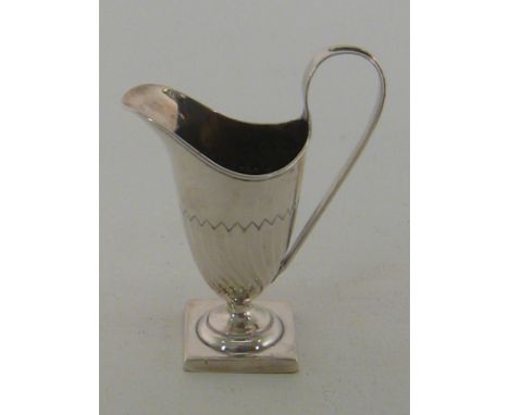 A late Victorian silver helmet shaped cream jug on square base, Thomas Hayes, Birmingham, 1891. Wt.93gm.