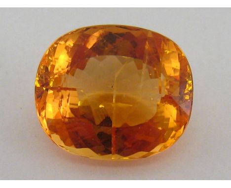 A loose polished golden topaz, approx. 16.11 ct, 16 x 13.7 x 8.5mm deep. VAT will be added to the hammer on this lot. CONDITI