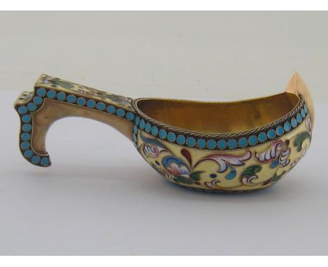 A small silver-gilt and cloisonné enamel kovsh bearing spurious Russian marks, with flowers on pale yellow ground with turquo