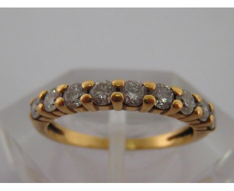 A French 18 carat yellow gold and diamond half eternity ring, the brilliants totalling approx. .45, carat, French makers cart