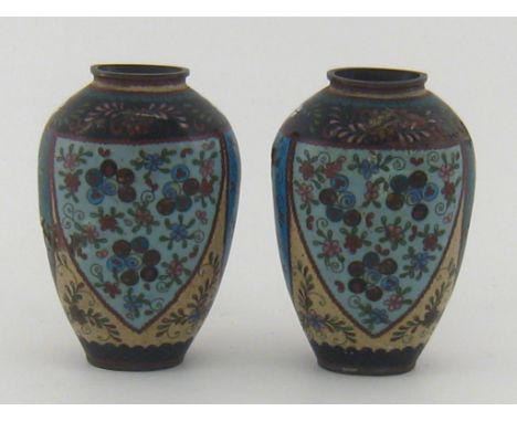 A pair of oval baluster Chinese cloisonne vases. Ht. 15cm. CONDITION REPORT: Both vases have significant damage to the enamel