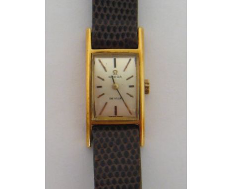 Omega De Ville, a lady's 18 carat yellow gold manual wind wristwatch, the small signed silvered rectangular dial with baton n