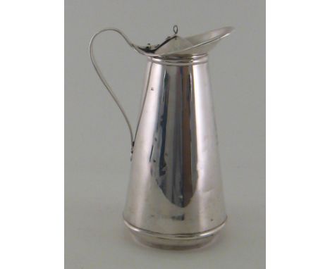 An Arts & Crafts silver hot water jug with insulated white enamel liner, by W. A. S. Benson & Co. Ltd., London, 1910, engrave