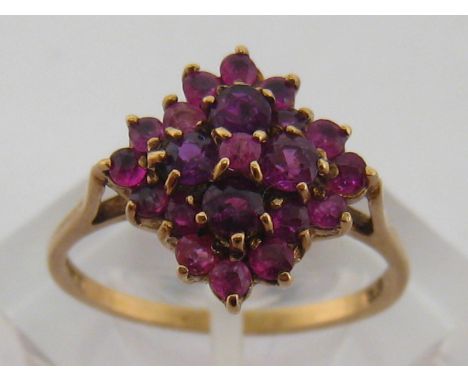 A 9 carat yellow gold and garnet cluster ring, fully hallmarked to shank, finger size Q/R, 2.7gms
 CONDITION REPORT: marks cl