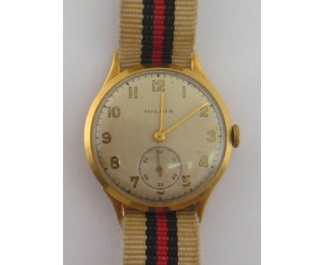Mildia, an 18 carat gold mid-size wristwatch, Helvetia standard mark to case, the silvered dial with gold Arabic numerals, go