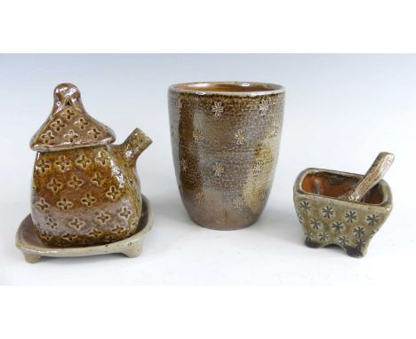 Fleen Doran - a salt-glazed novelty teapot and cover in the form of a cottage, on stand, h.10cm; together with a sugar bowl, 