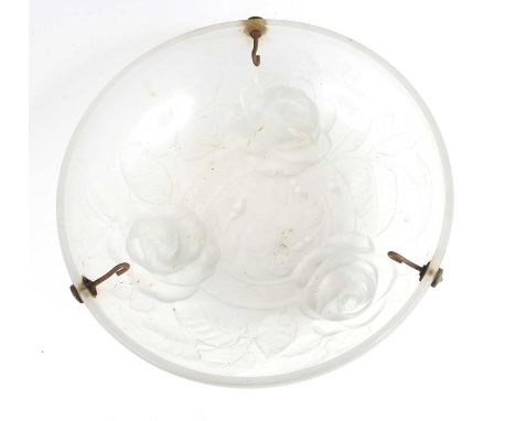 A French Art Deco frosted and moulded glass ceiling light, raised on chainlink suspended attachments, with raised rose flower