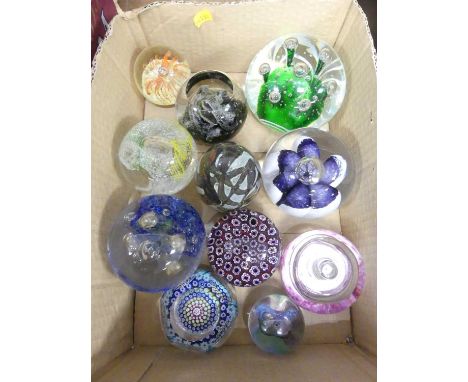 A collection of art glass paperweights, to include examples by Mdina and Caithness 