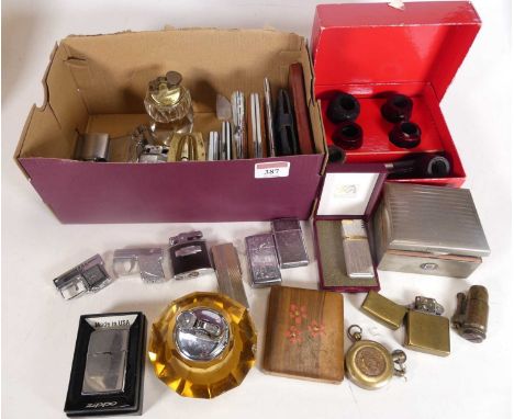 A collection of smoking related items to include Zippo lighters, Ronson lighters, and various cigarette cases