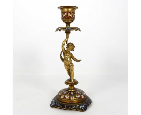 A late 19th French gilt brass and champleve enamel figural candlestick, bearing a paper label to the underside, height 19cm