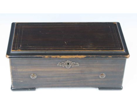 A late 19th century Swiss music box, the lever wind mechanism playing six airs on a 6" cylinder, the winding arm numbered 307