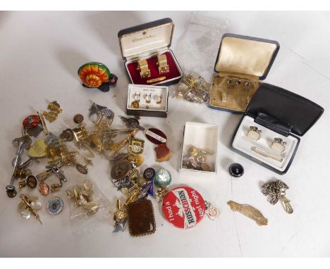 A collection of costume jewellery, mostly cufflinks; together with various dress studs and badges 