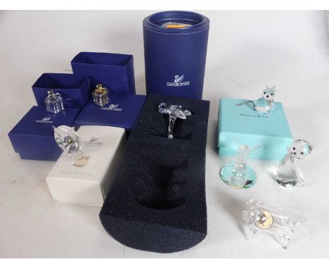 A collection of Swarovski cut glass ornaments to include bells, daisy, and a present, together with other cut glass ornaments