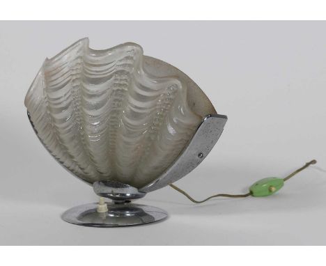 An Art Deco table lamp, having a frosted shell shaped glass shade, on a chrome support, h.22cm 