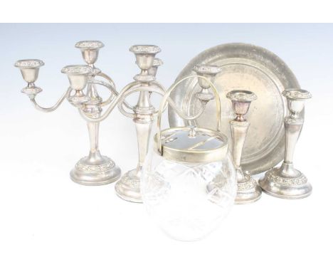A collection of metalwares to include a pair of silver plated three sconce table candelabra, a pair of candlesticks, biscuit 