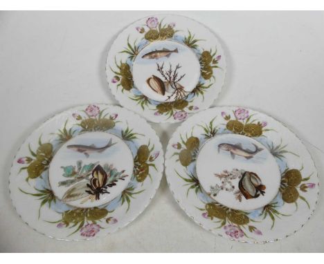 A collection of ceramics, to include a Royal Doulton floral decorated pottery charger, dia.34cm; a set of three porcelain cab