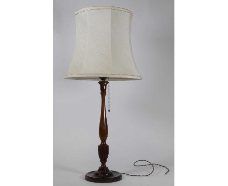 A turned walnut table lamp, h.44cm (excluding fittings)
