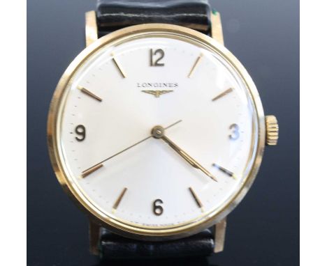 A Longines gent's 9ct gold cased manual wind wristwatch, having  a signed champagne dial with quarter Arabic numerals, the ba