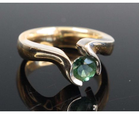 A contemporary 14ct gold emerald solitaire ring, the round cut emerald weighing approx 0.6 carats, size N, 10.5gEmerald appea