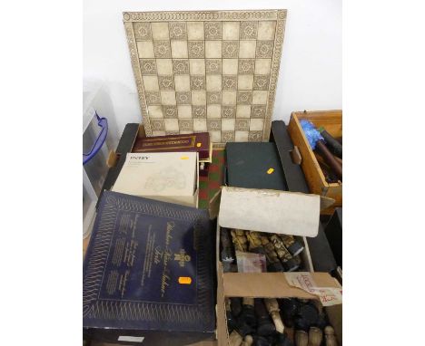 Two boxes of games, to include three complete chess sets 